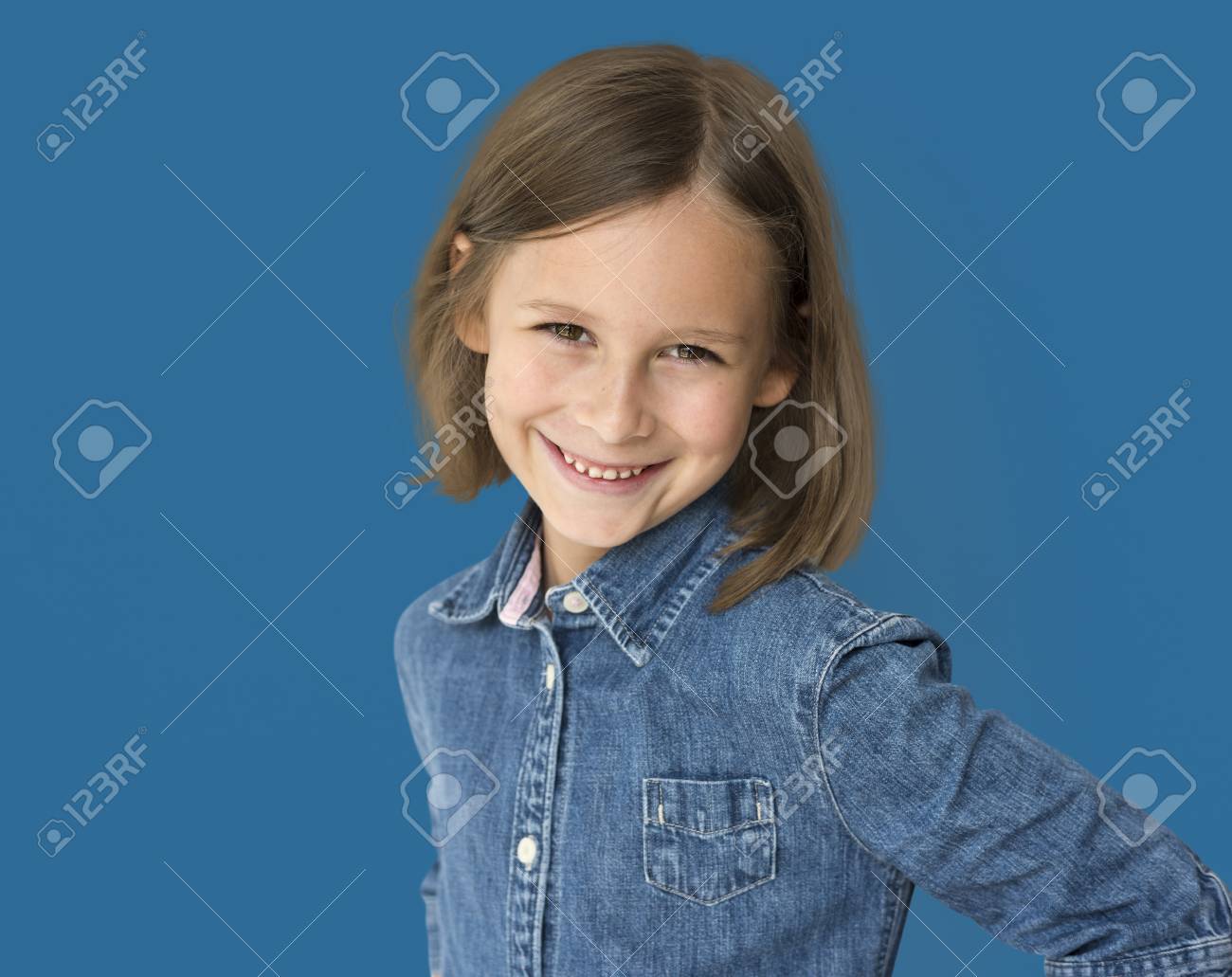 Short Haired Brunette Young Girl Smiling Studio Portrait Stock