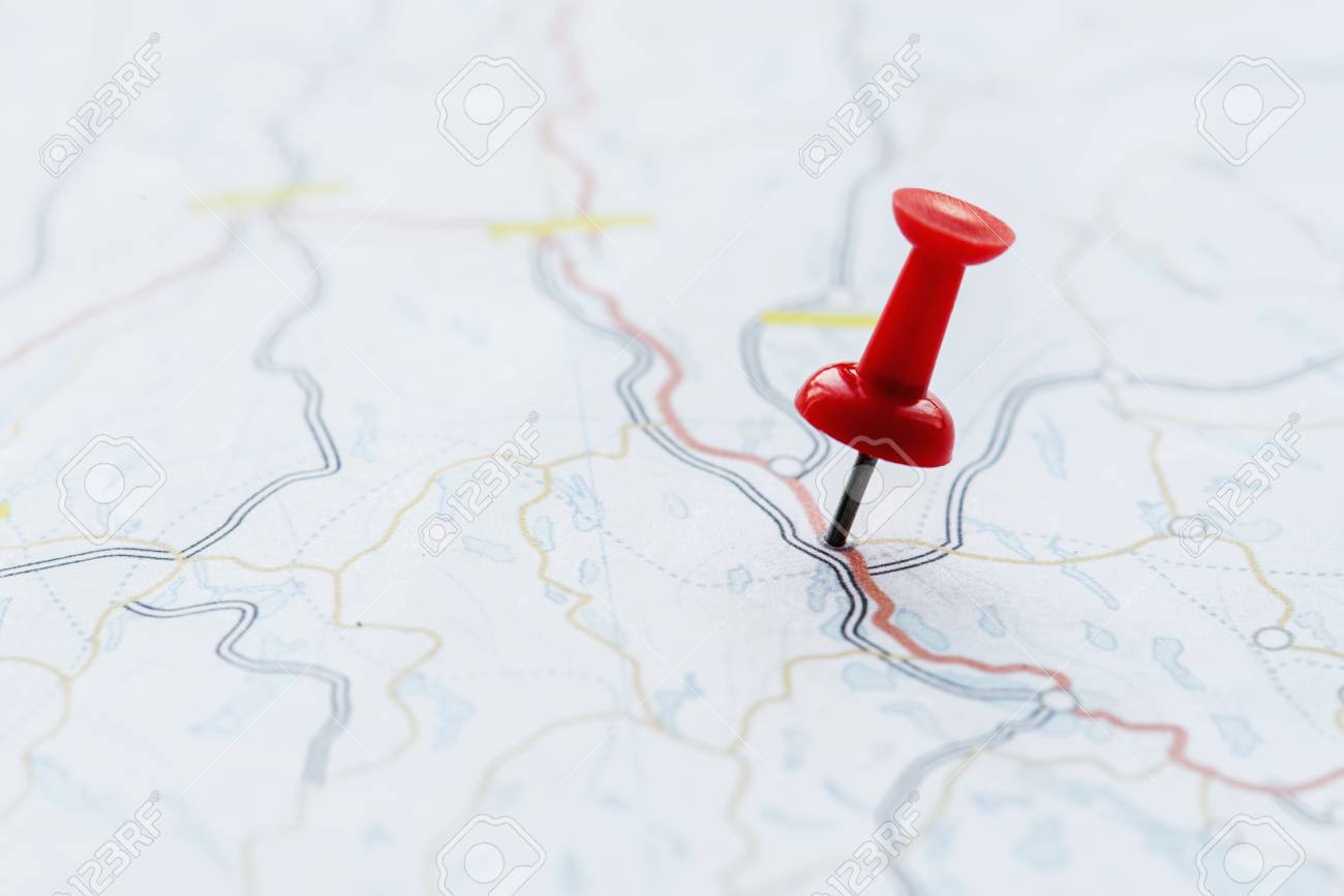 Closeup of pushpin showing the location on the map - 85968879 Closeup of pushpin showing the location on the map - 85968879