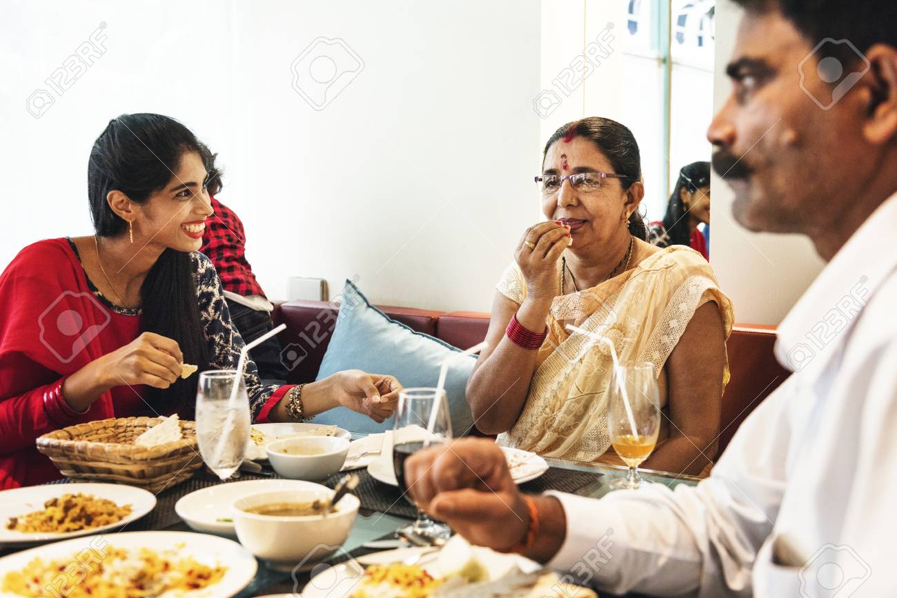 Family having Indian food - 95980528 Family having Indian food - 95980528