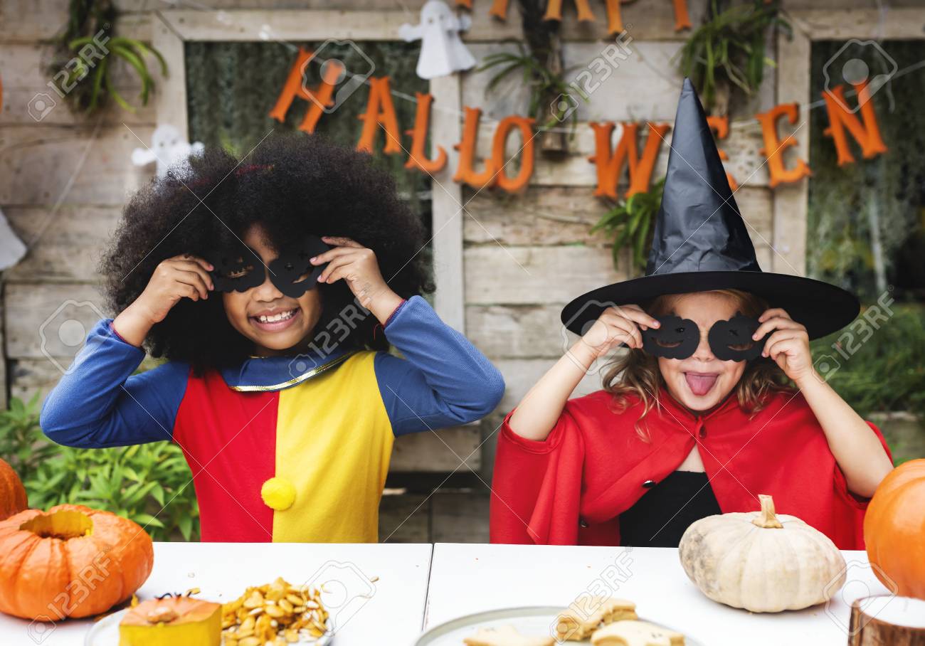 Kids in costume enjoying the Halloween season - 111778699 Kids in costume enjoying the Halloween season - 111778699