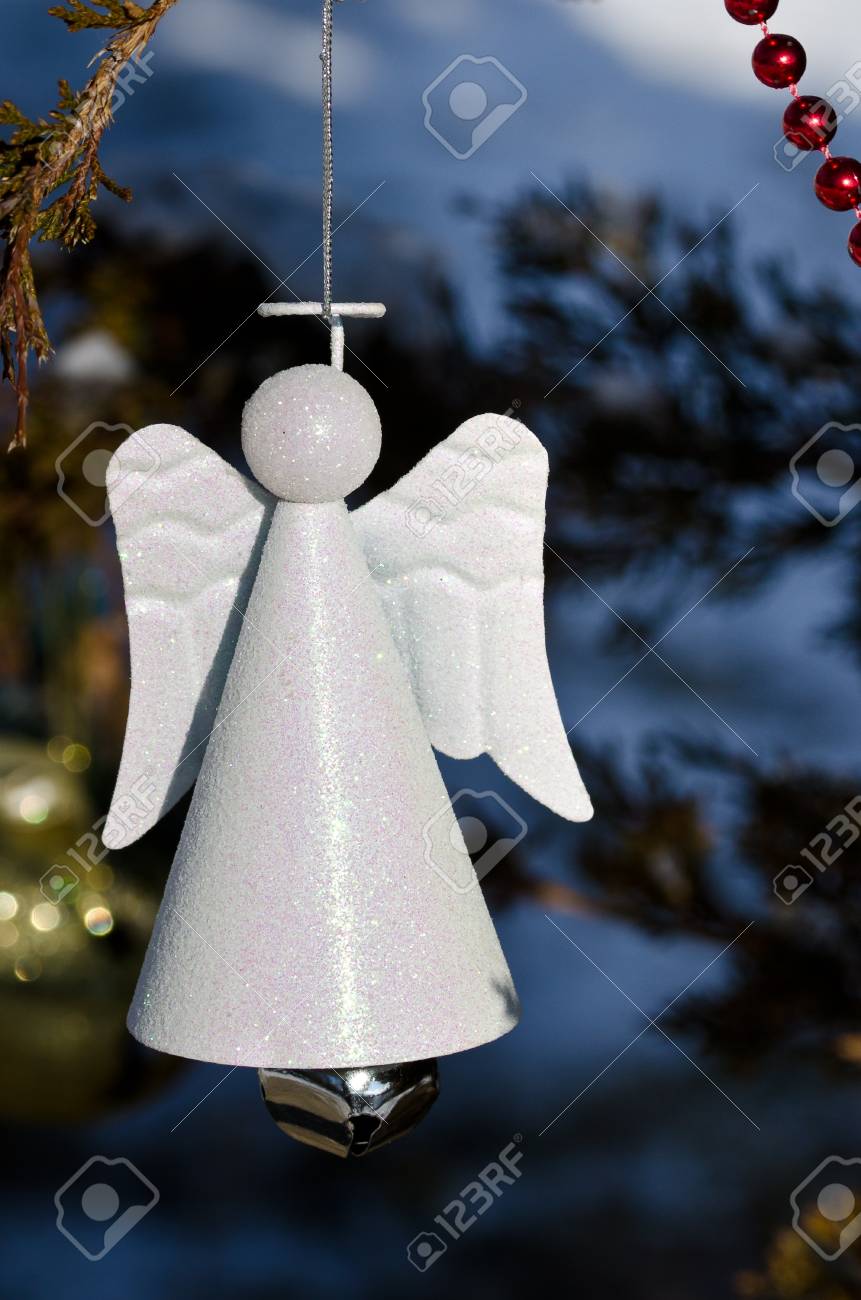 Stock Photo White Angel Christmas Ornament Decorating An Outdoor Tree Stock Photo White Angel Christmas Ornament Decorating An Outdoor Tree