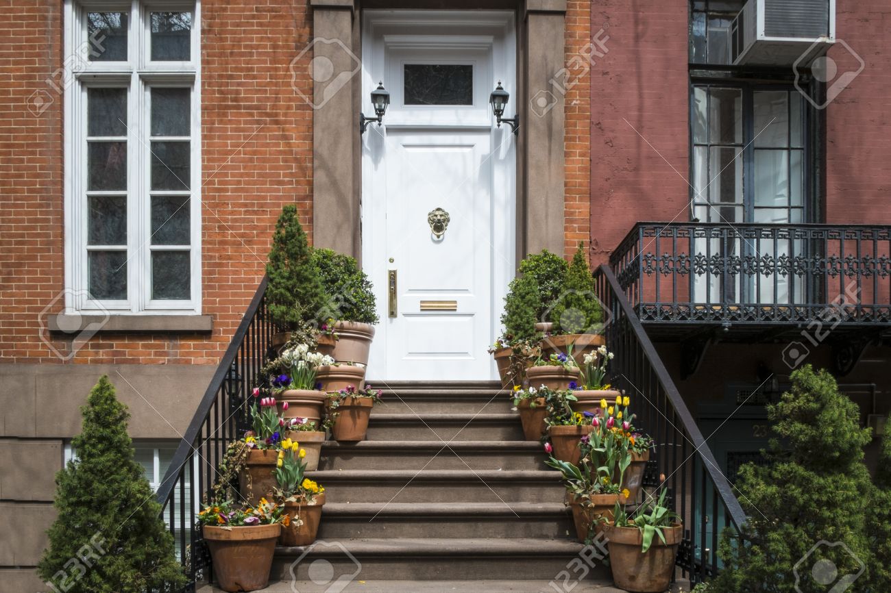 City Apartment Building Entrance entrance to greenwich village apartment with flowerpots on steps City Apartment Building Entrance entrance to greenwich village apartment with flowerpots on steps