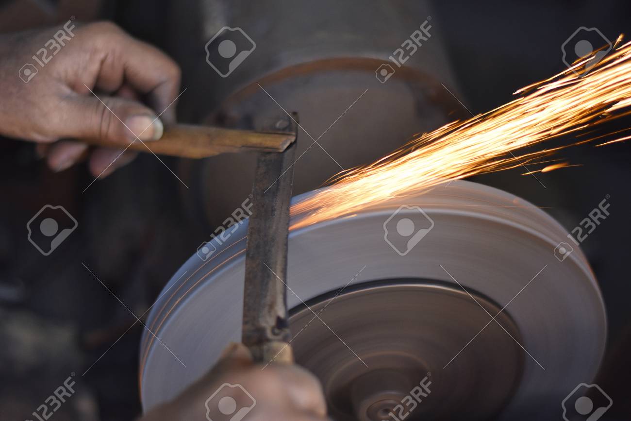 man grinding on abrasive