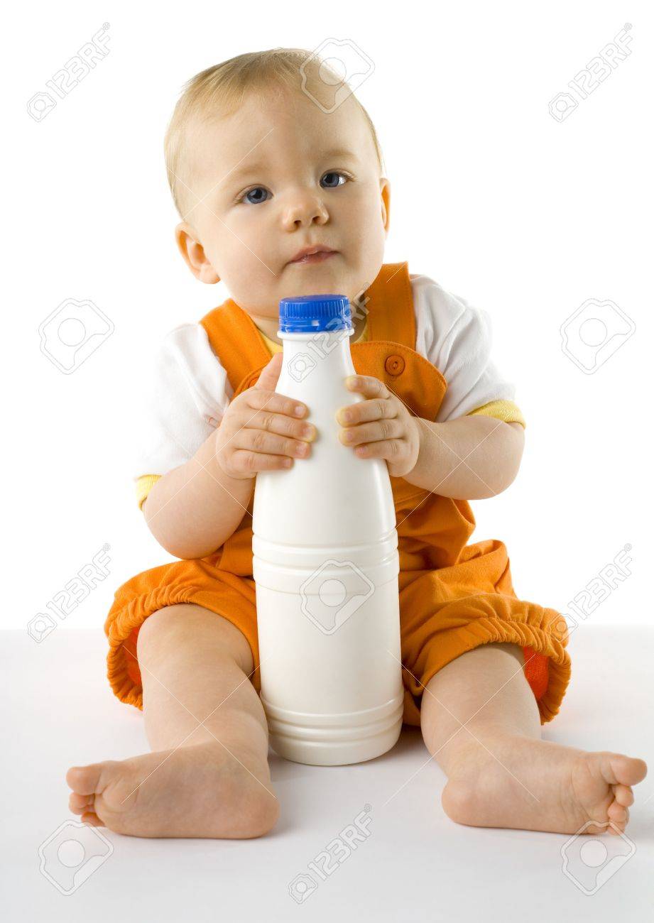 baby holding bottle