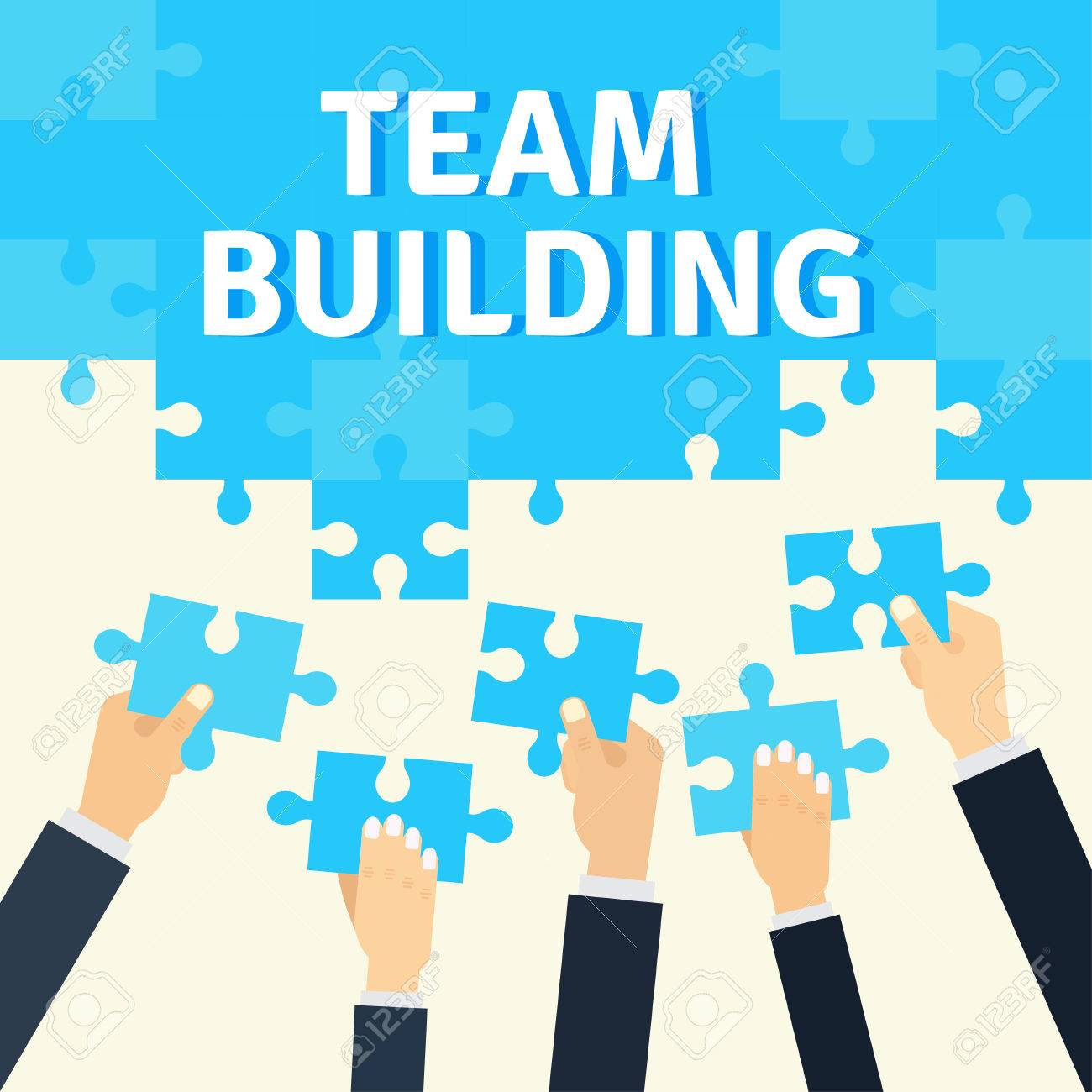 employees holding and connecting puzzle pieces together corporate