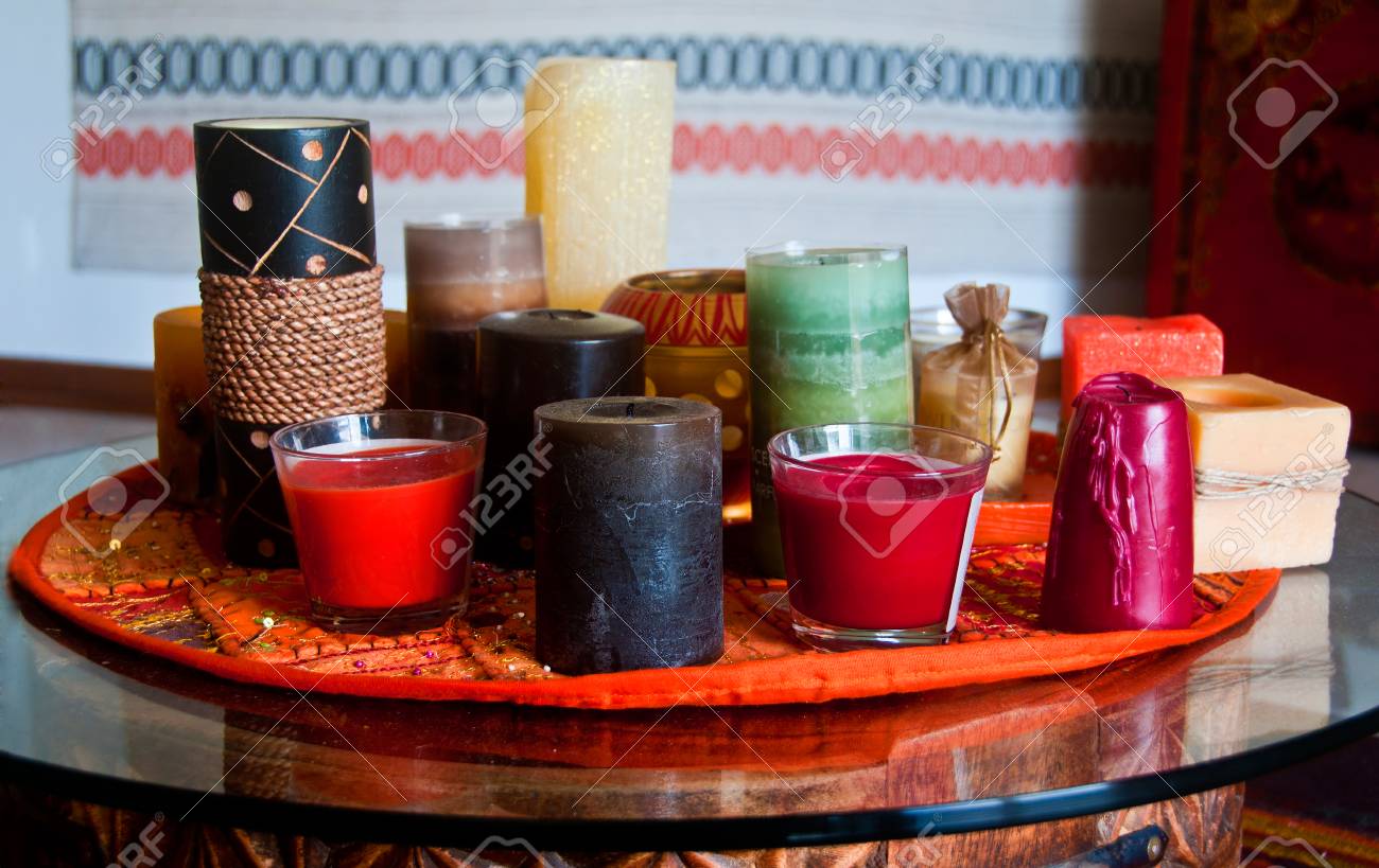 Candles of different shape and colour on a table - 33975773 Candles of different shape and colour on a table - 33975773