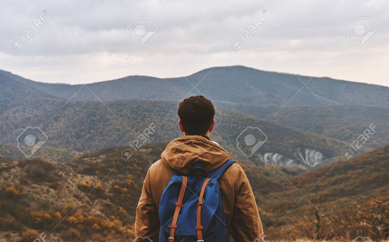 Hiker Man With Backpack Enjoying Landscape Of Autumn Mountains Stock Photo Picture And Royalty Free Image Image