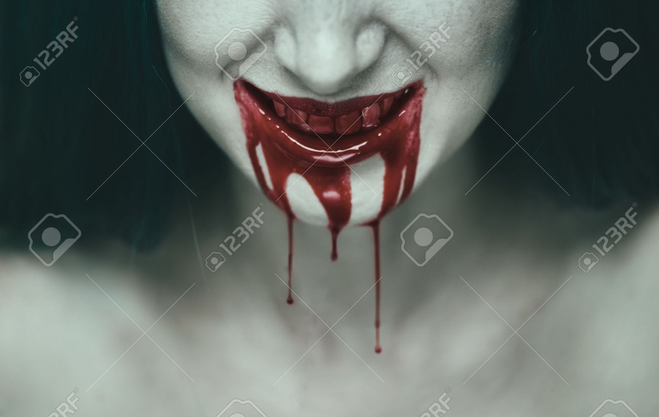 Spooky woman smiling, mouth of woman in blood. Halloween or horror theme - 47339671 Spooky woman smiling, mouth of woman in blood. Halloween or horror theme - 47339671