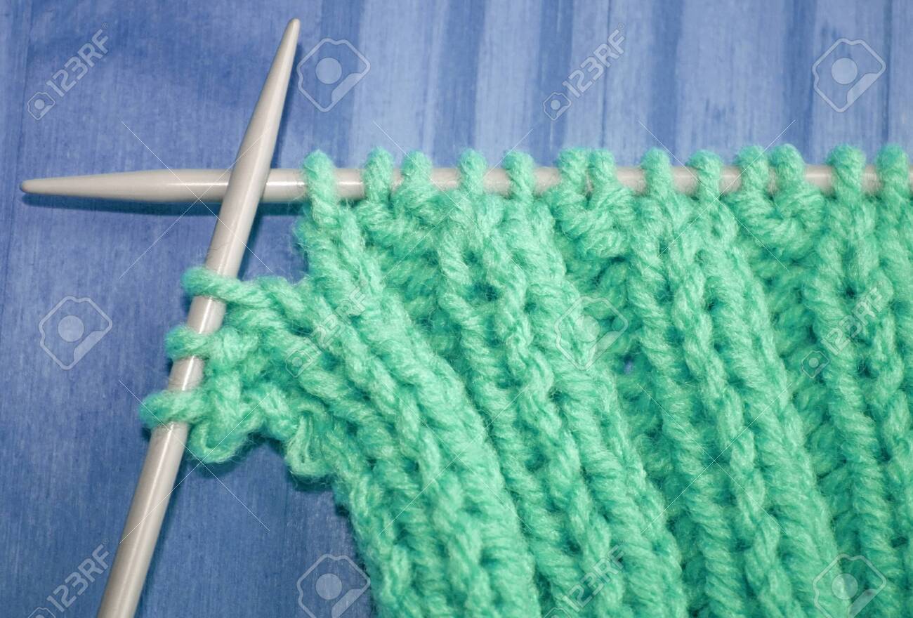 Knitted Stitches On A Pair Of Knitting Needles Knitted Stitches On A Pair Of Knitting Needles