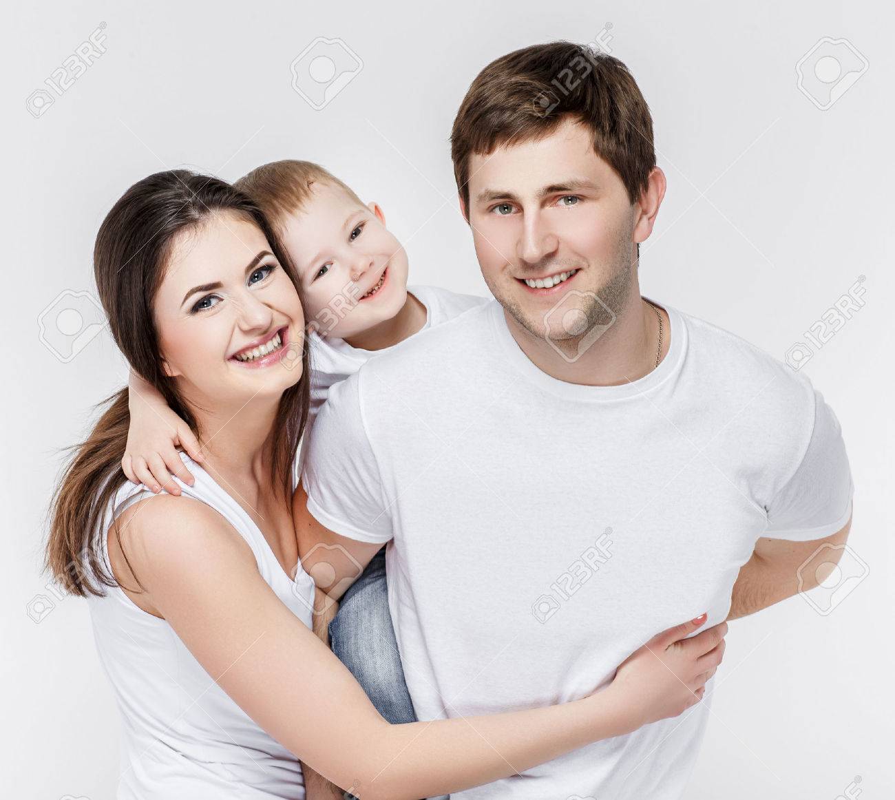 A happy family on light grey background - 52123577 A happy family on light grey background - 52123577