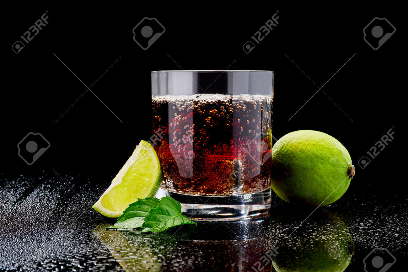 Whiskey with steel cooling cubes on dark glass background - 169835566 Whiskey with steel cooling cubes on dark glass background - 169835566