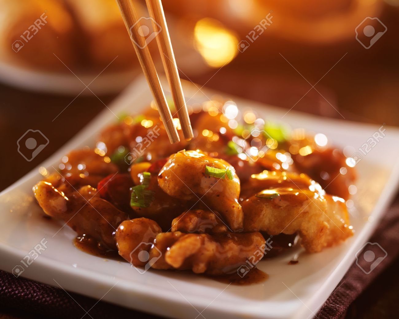 Eating Chinese Food General Tsos Chicken With Chopsticks