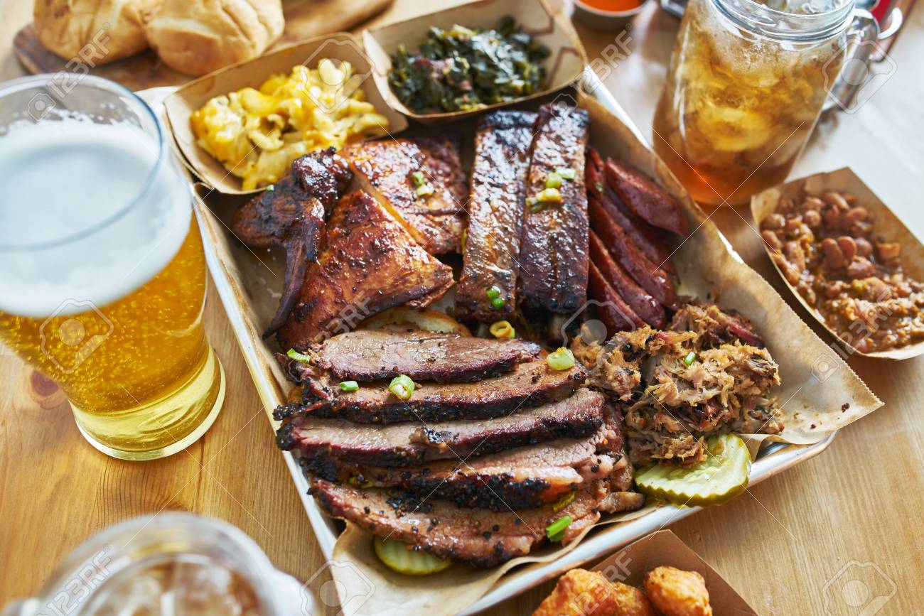 texas style bbq tray with smoked brisket, st louis ribs, pulled pork, chicken, hot links, and sides - 118468791 texas style bbq tray with smoked brisket, st louis ribs, pulled pork, chicken, hot links, and sides - 118468791