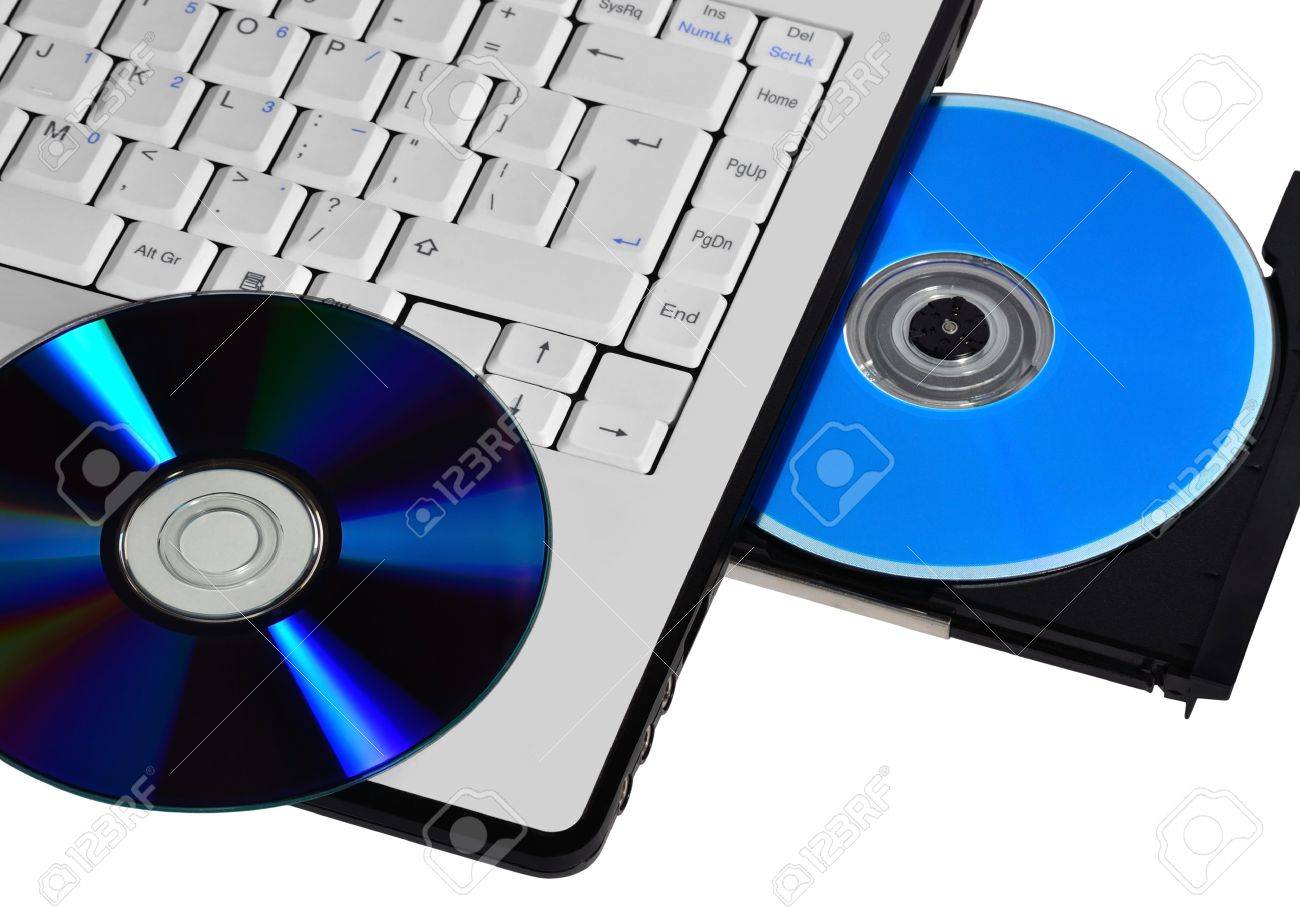 laptop with open compact disc tray and CD or DVD on the keyboard - 10997627 laptop with open compact disc tray and CD or DVD on the keyboard - 10997627