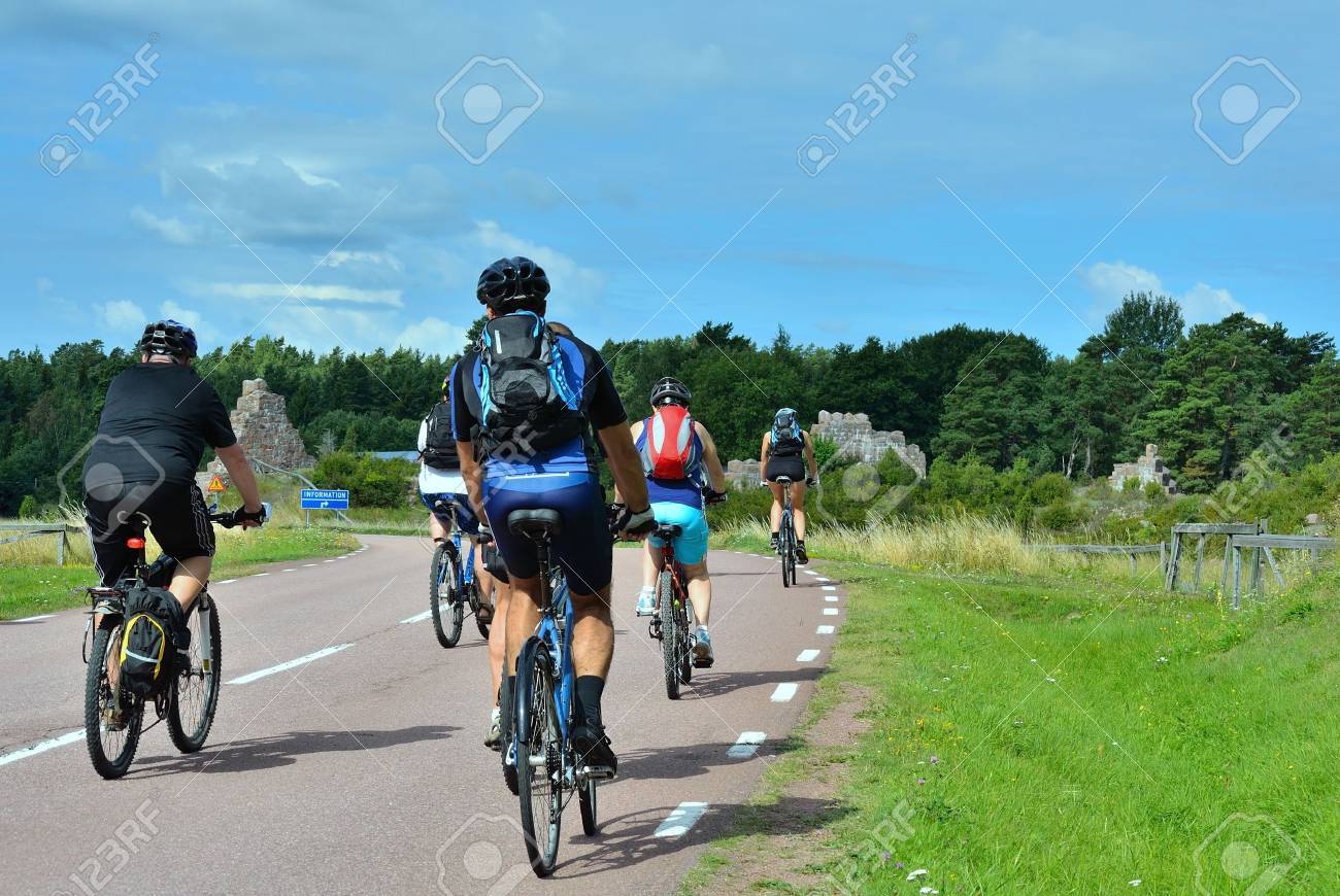 group of cyclists going on the road in the countryside - 12734278 group of cyclists going on the road in the countryside - 12734278