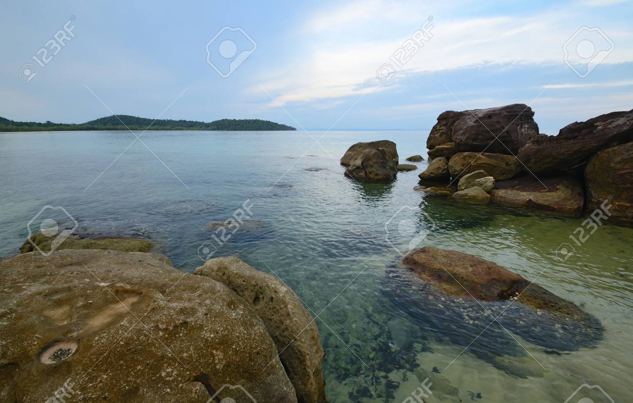 sea view on tropical island with crystal clear water in the evening light - 74620565 sea view on tropical island with crystal clear water in the evening light - 74620565