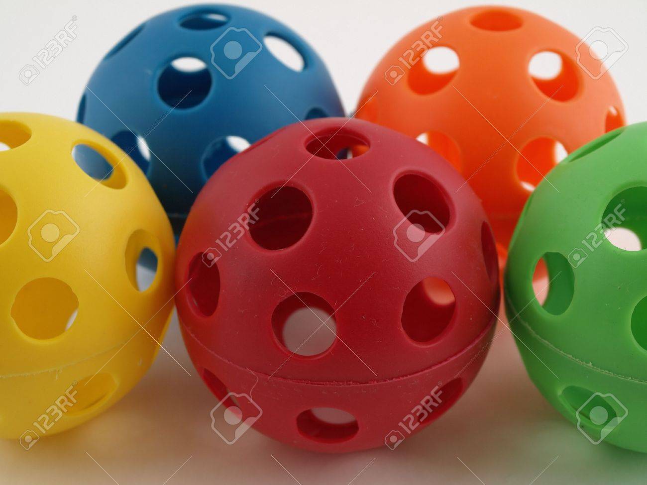 plastic balls with holes in them