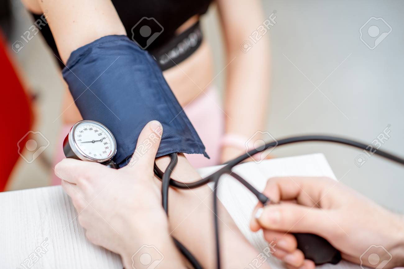 Close-up of a blood pressure measuring process - 116648407 Close-up of a blood pressure measuring process - 116648407