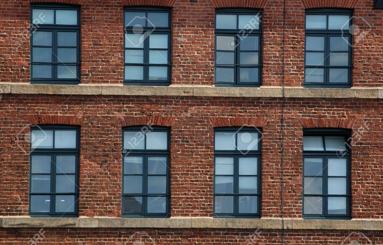 Brick Apartment Building Window windows and brick in an old industrial building near the royal Brick Apartment Building Window windows and brick in an old industrial building near the royal