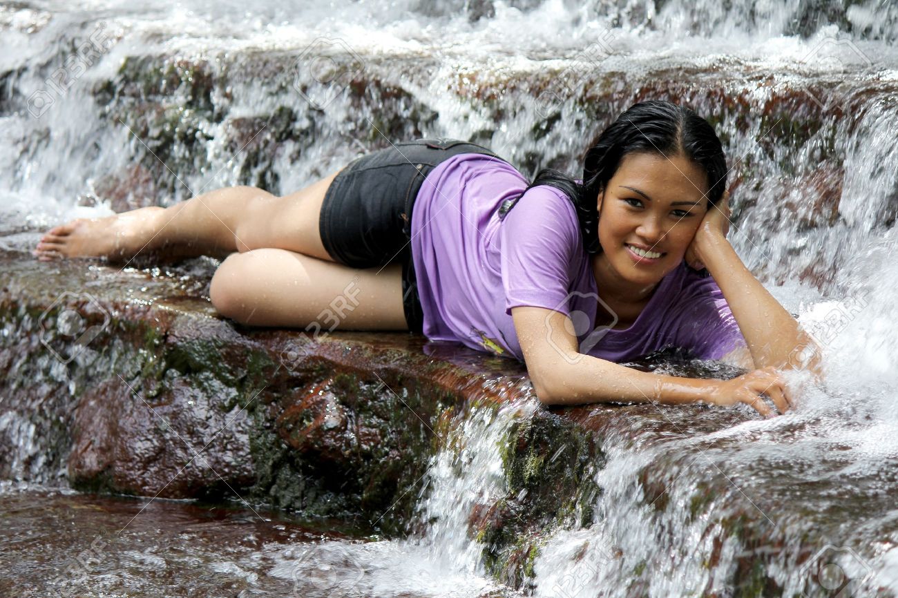 Sexy Filipina Lying In A Natural Fresh Water Spring With Flowing Water  Around Her Stock Photo, Picture and Royalty Free Image. Image 20133906.
