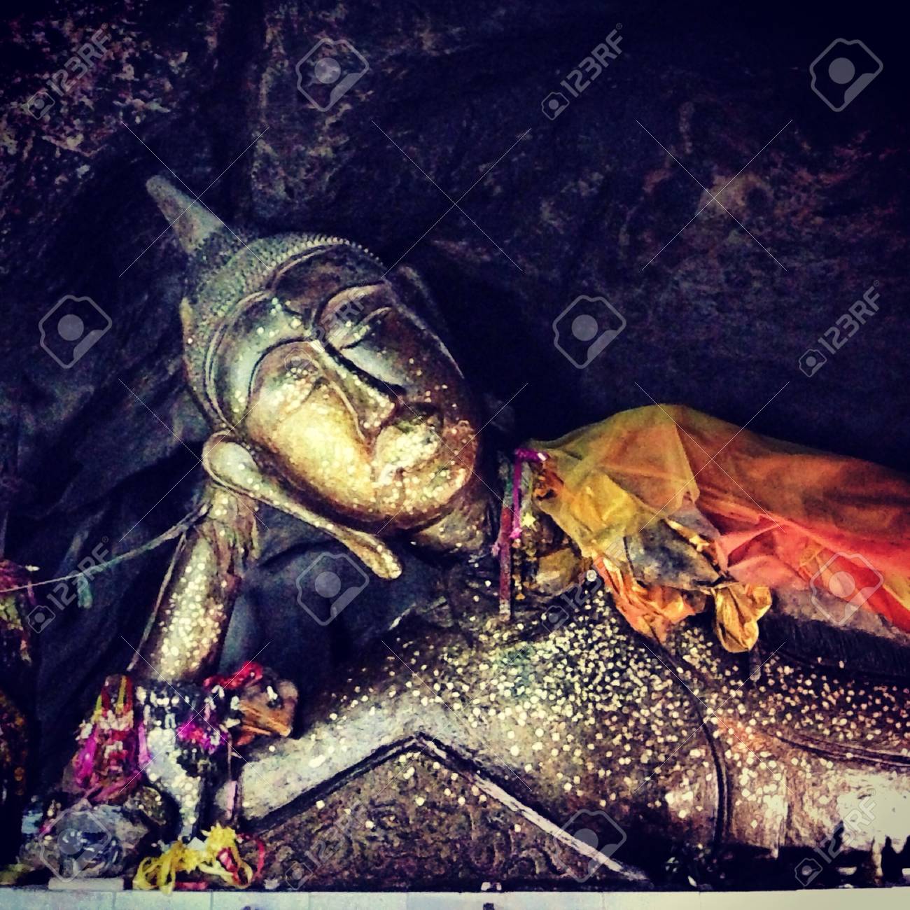 The image of sleeping Buddha in a cave of Thailand - 21661726 The image of sleeping Buddha in a cave of Thailand - 21661726