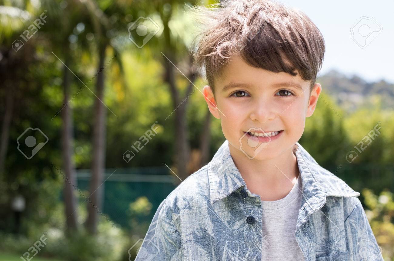 Portrait Of A Little Happy Boy Looking At Camera. Happy Kid Smiling With Toothy Smile. Beautiful Child In Casual Outdoor. Stock Photo, Picture and Royalty Free Image. Image 56370614.