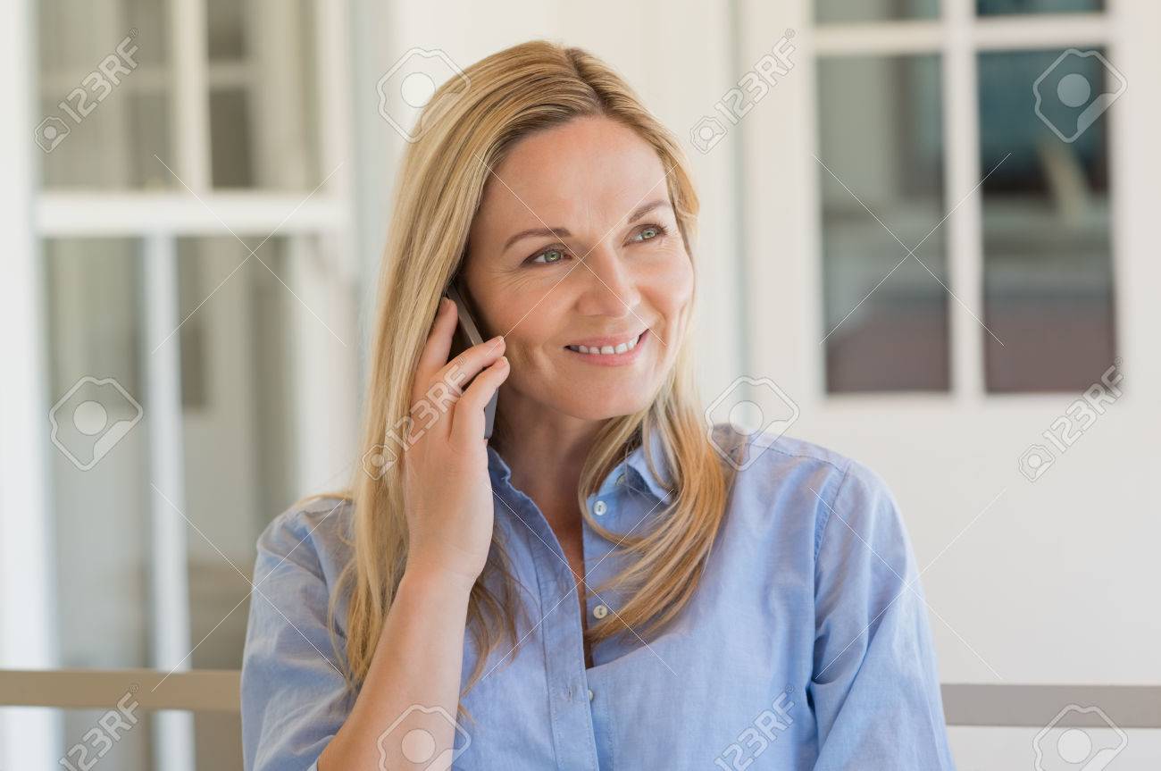 Cheerful Mature Woman Talking Over