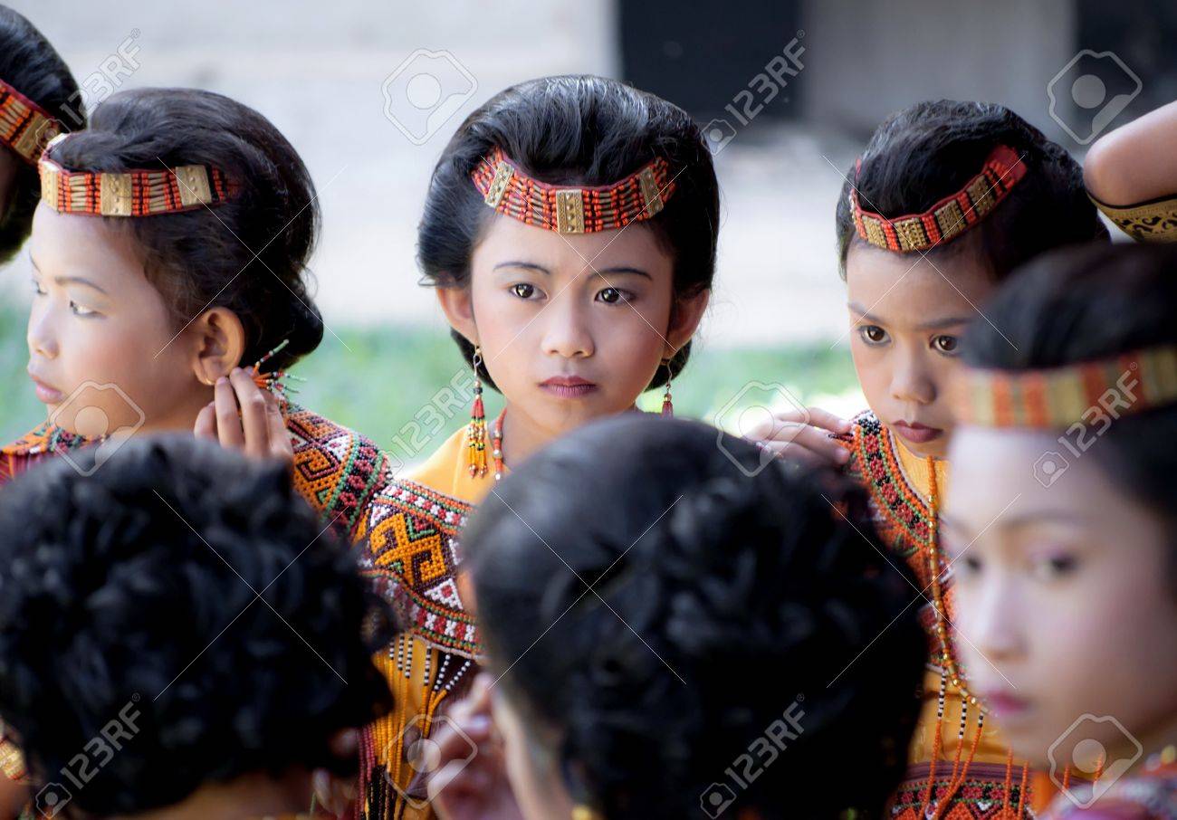 Children Dressed With Traditional Toraja Clothes During A Funeral