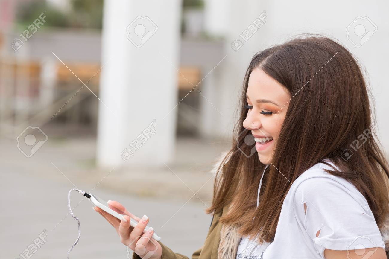 Young Woman Busy With Her Mobile Phone Stock Photo, Picture and ...