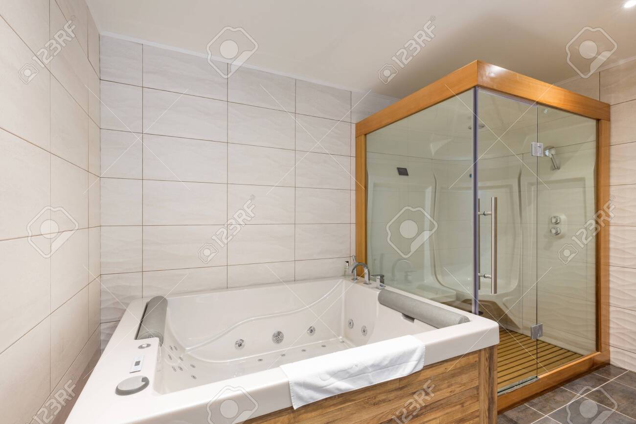 interior of luxury hotel bathroom with hydromassage bathtub and shower cabin - 154301932 interior of luxury hotel bathroom with hydromassage bathtub and shower cabin - 154301932
