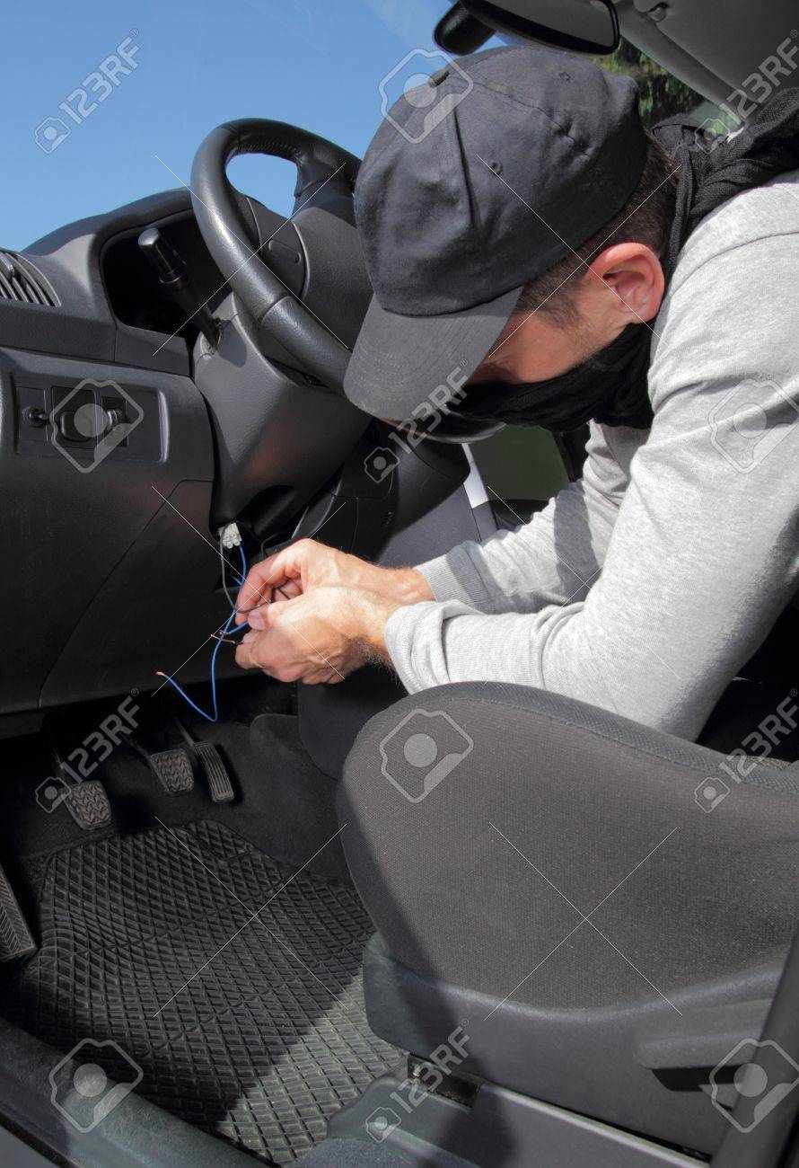 Car Thief Hot Wiring The Electrical Circuits On The Ignition Stock Photo Picture And Royalty Free Image Image 13676404