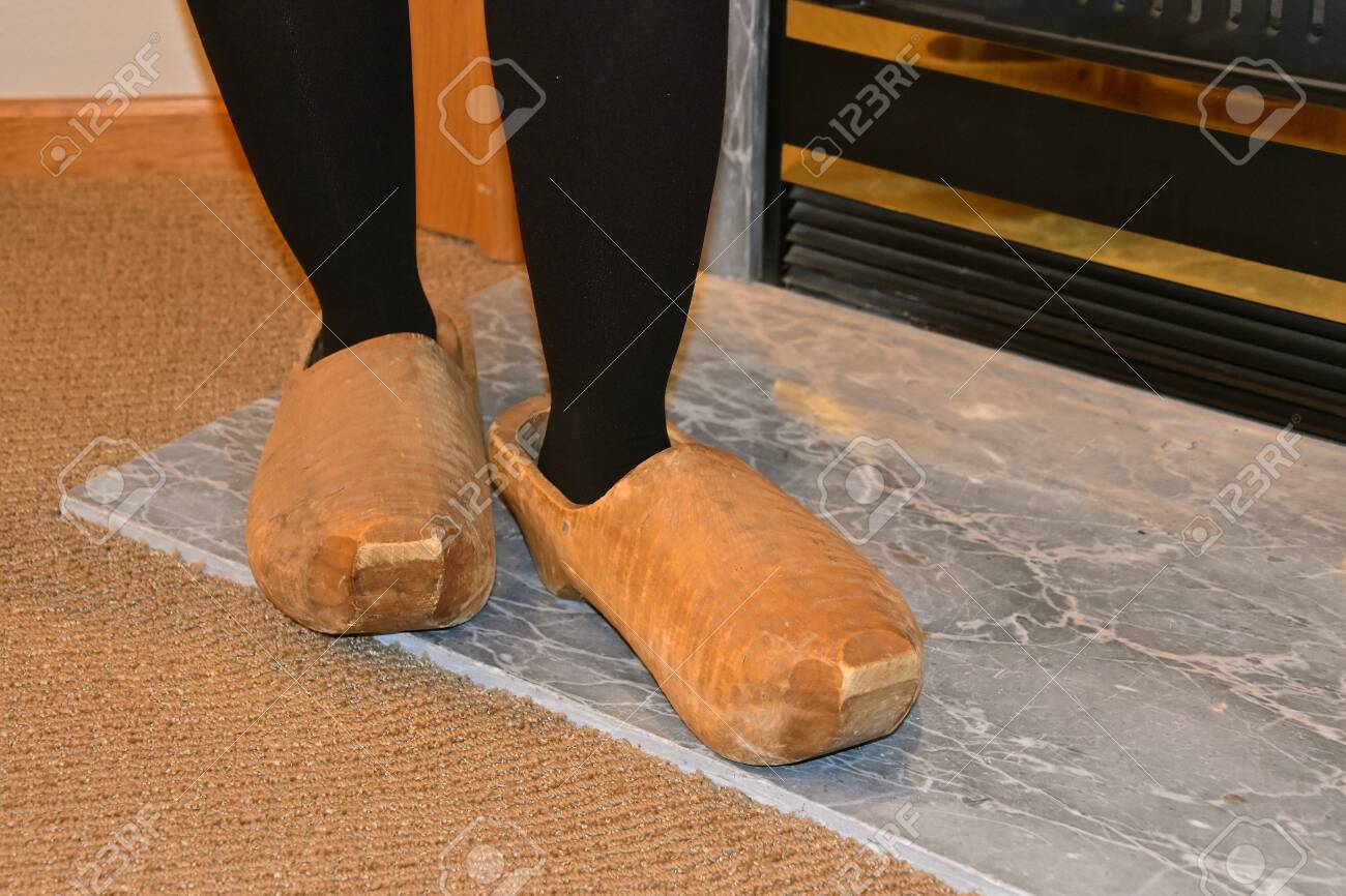 wearing oversized shoes