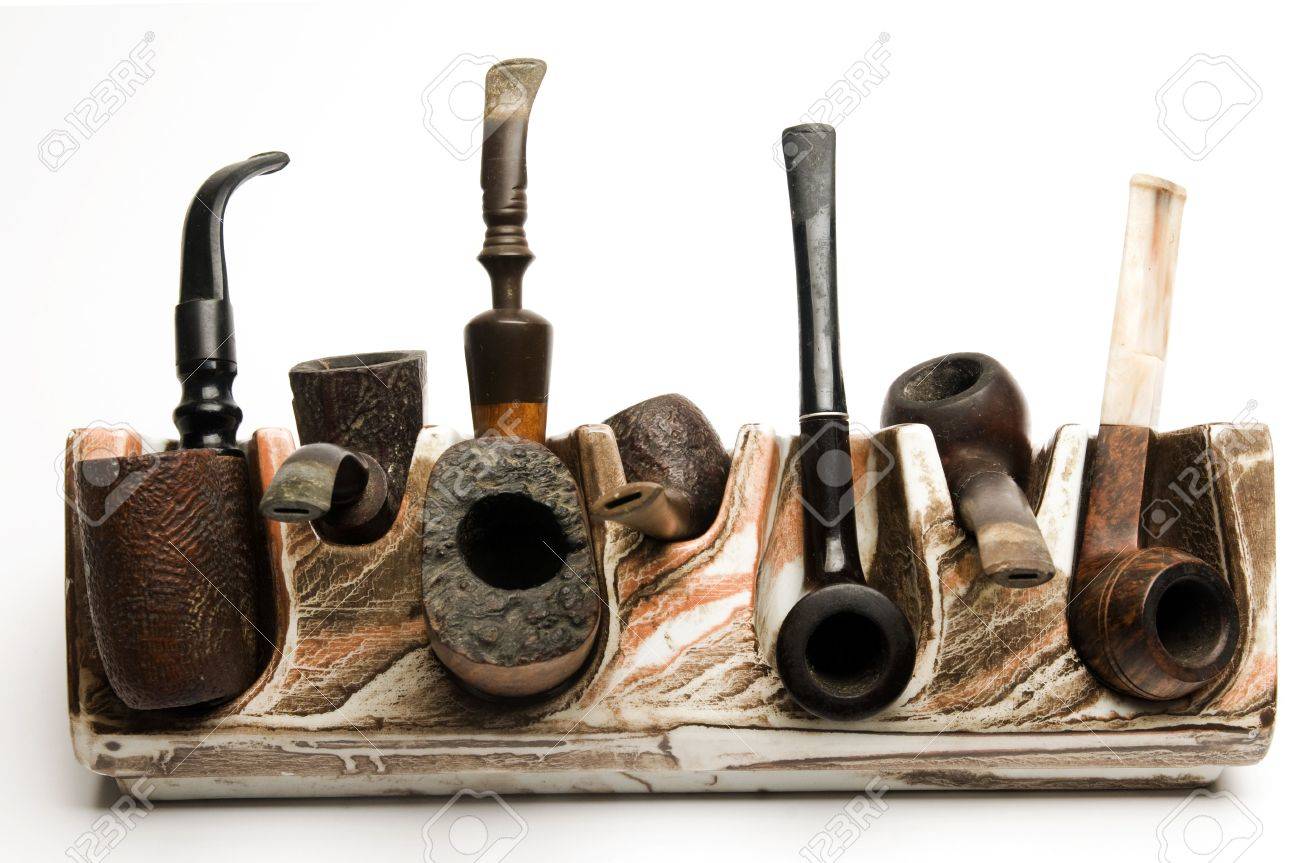 Variety Of Pipe Collection On Modern Pipe Rack On White Background