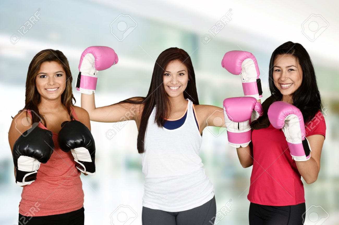Group of people doing a kick boxing workout - 43679547 Group of people doing a kick boxing workout - 43679547