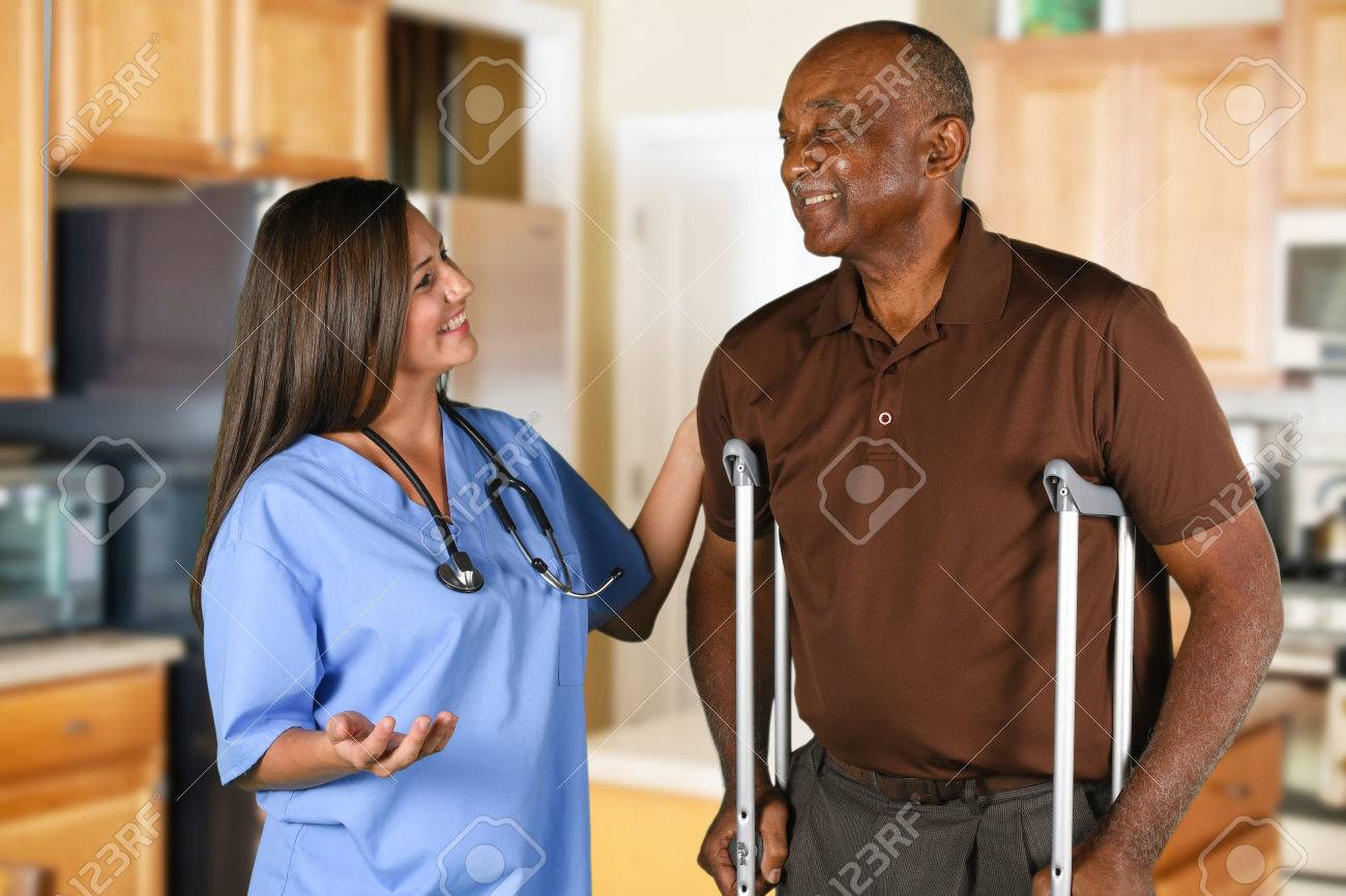 Health care worker helping an elderly patient - 62452162 Health care worker helping an elderly patient - 62452162
