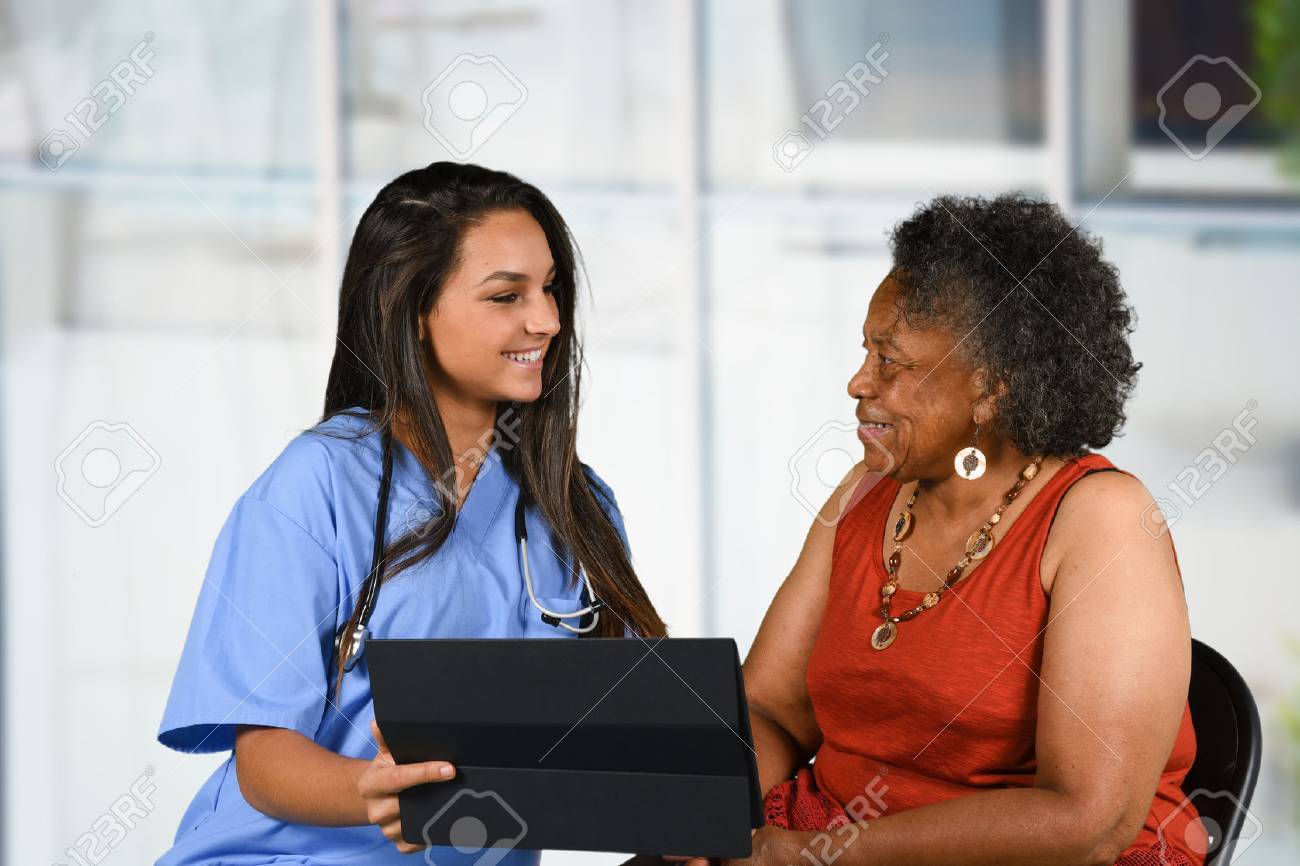 Health care worker helping an elderly woman - 62452197 Health care worker helping an elderly woman - 62452197
