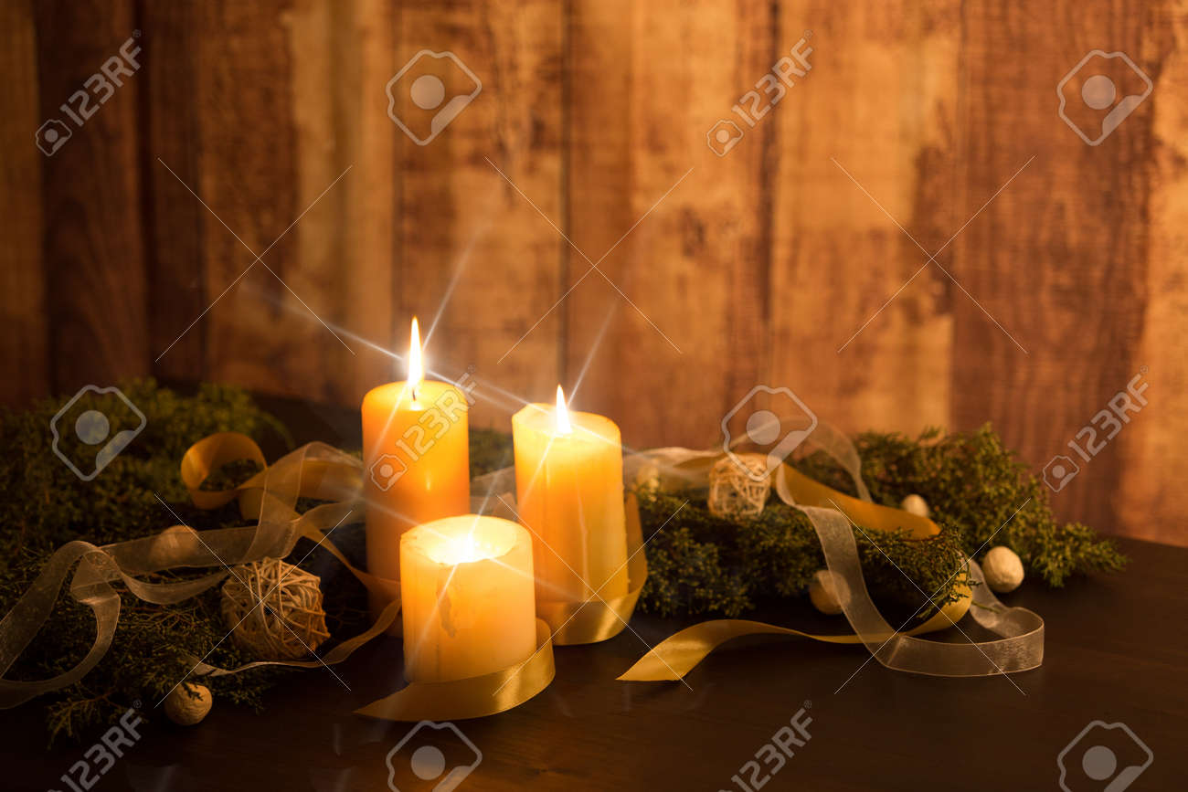 The Warmth Of The Christmas Concept Three Candles Lit With Cross Stock Photo Picture And Royalty Free Image Image 145901969
