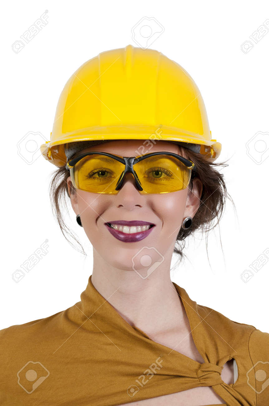 a female construction worker wearing a hard hat and safety glasses