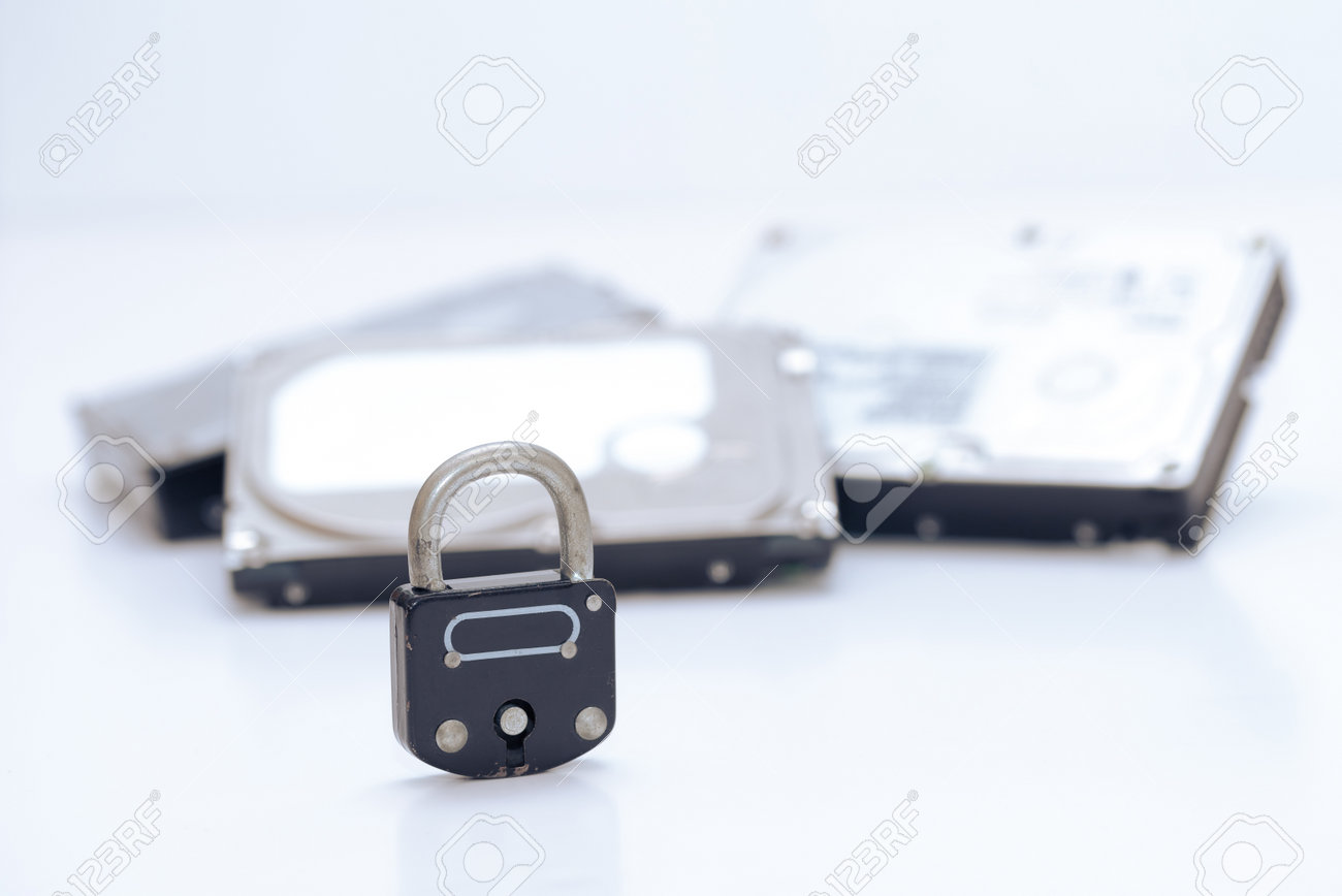 Computer hard disks and metal padlock symbolizing concept for encrypted data, cyber security on white background - 162314756 Computer hard disks and metal padlock symbolizing concept for encrypted data, cyber security on white background - 162314756