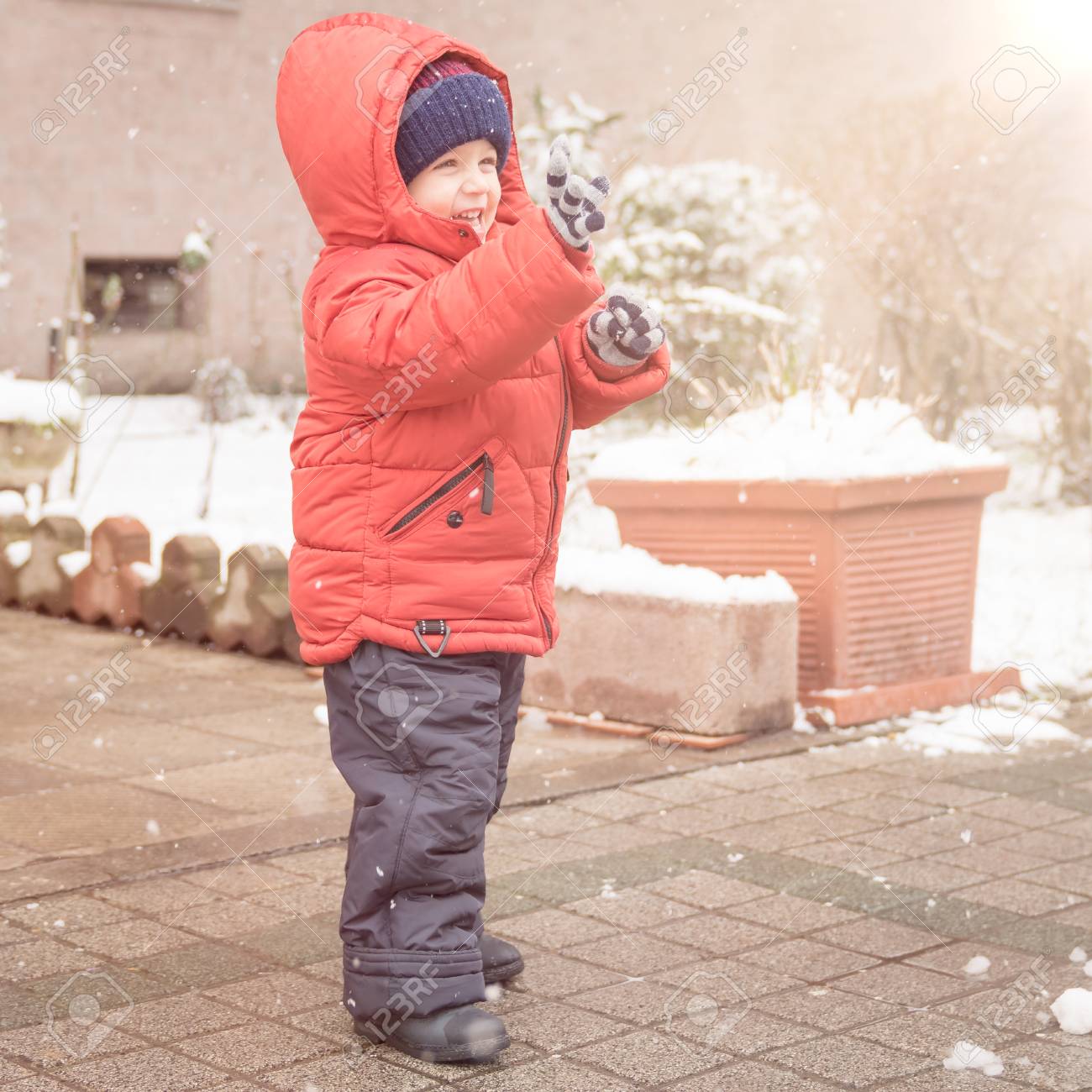 Infant Boy Smiles Cheerfully While It S Snowing Dressed In A Stock Photo Picture And Royalty Free Image Image 98320060