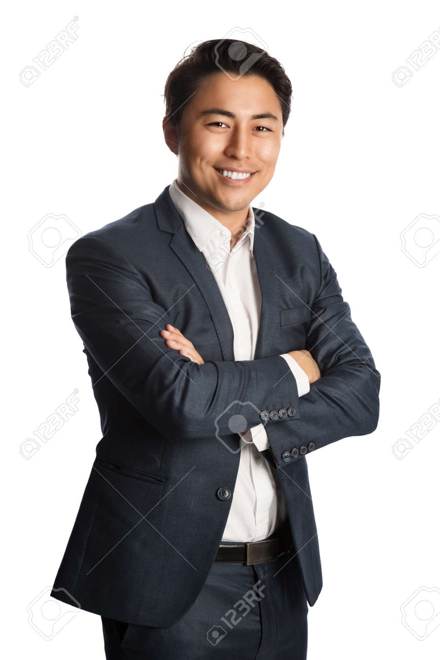A well dressed businessman in a blue suit and white shirt, standing against a white background smiling towards camera. - 136716261 A well dressed businessman in a blue suit and white shirt, standing against a white background smiling towards camera. - 136716261
