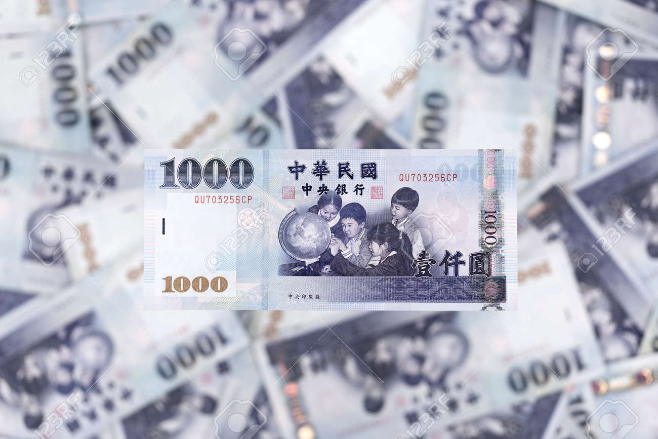 A 1000 NTD Bill In Sharp Focus Above A Pile Of Bills Stock Photo, Picture  and Royalty Free Image. Image 100768769.