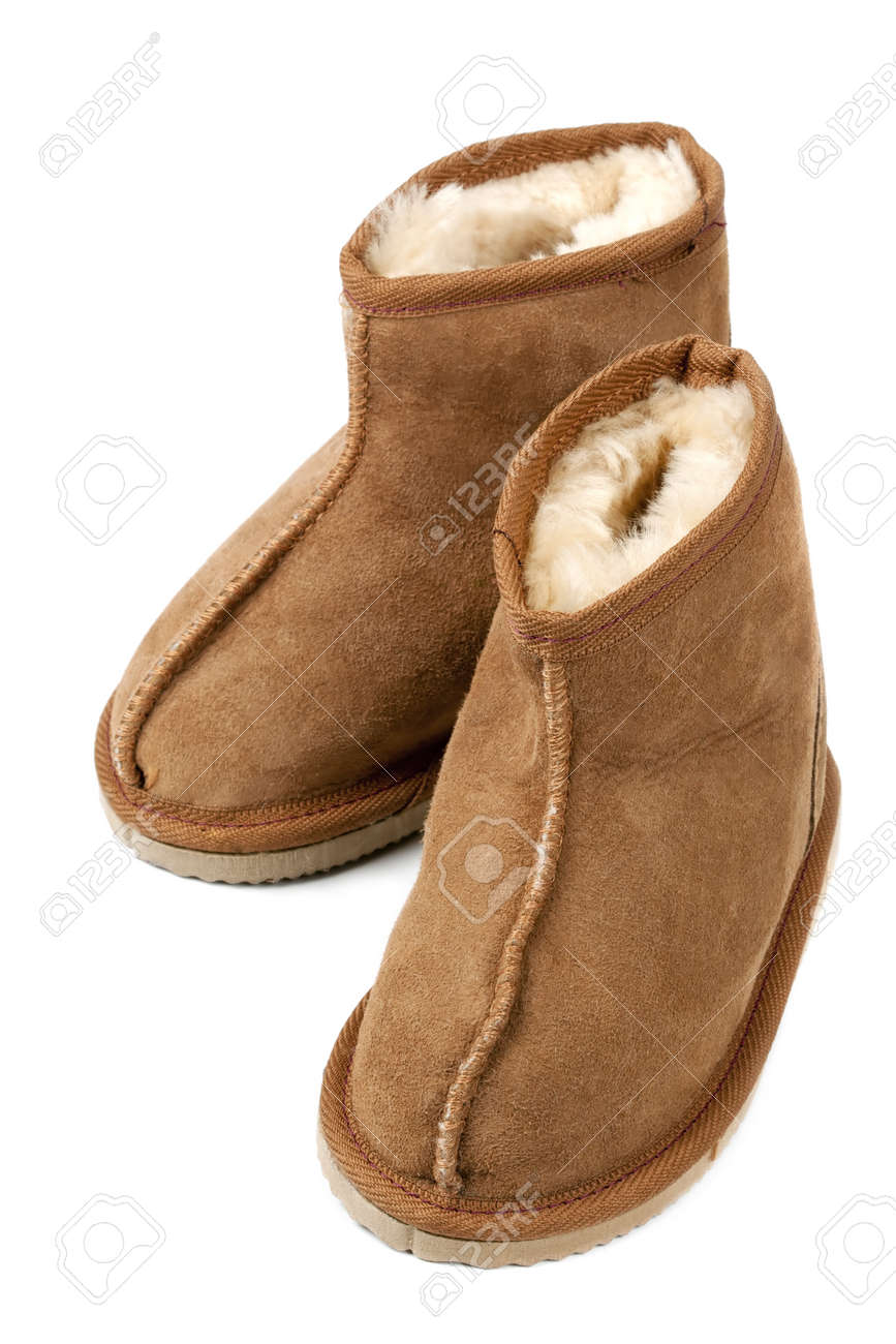 Par De Botas De Piel De Oveja De Tamaño Del Niño, Aislado En Par De Botas De Piel De Oveja De Tamaño Del Niño, Aislado En