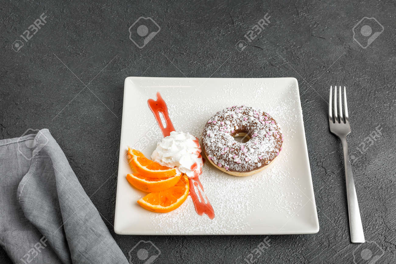 doughnut on plate isolated on black background - 167193529 doughnut on plate isolated on black background - 167193529