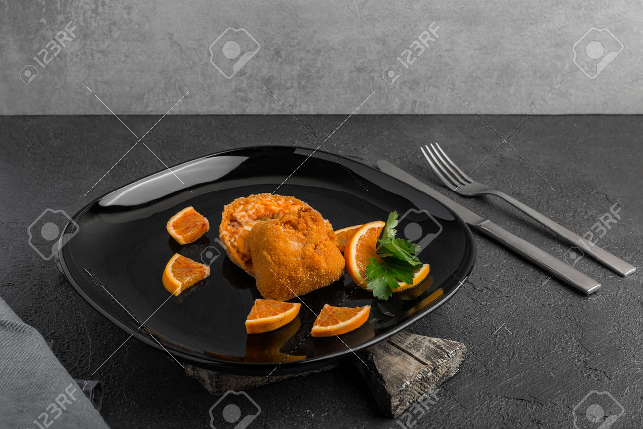 filled fried rice balls covered with breadcrumbs - 167779818 filled fried rice balls covered with breadcrumbs - 167779818