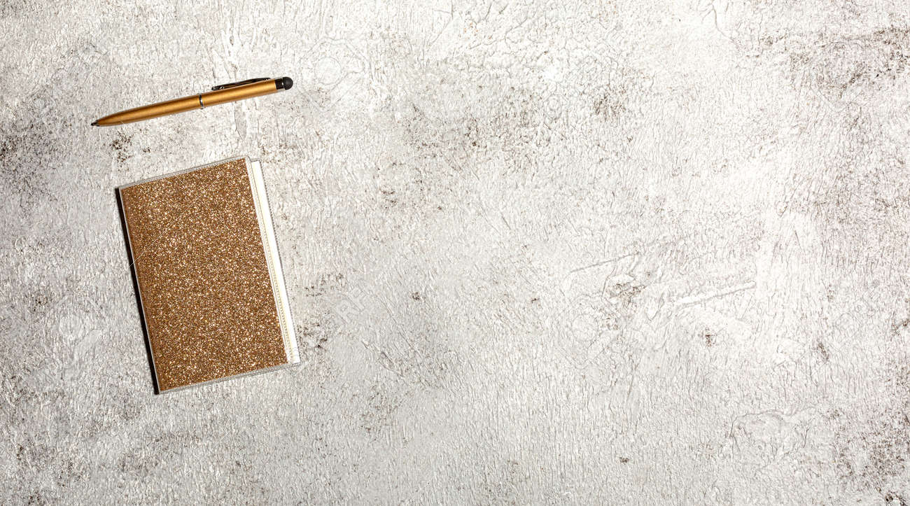 Mockup with notebook isolated on concrete background - 167779828 Mockup with notebook isolated on concrete background - 167779828