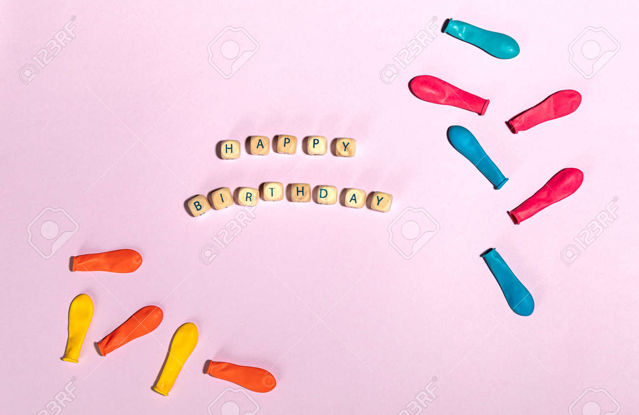 Flatlay of colorful balloons with text happy birthday - 167780040 Flatlay of colorful balloons with text happy birthday - 167780040
