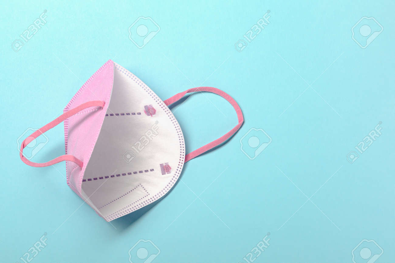Creative minimal flat lay layer with KN95 or N95 FFP2 mask for protection pm 2.5 - 167780058 Creative minimal flat lay layer with KN95 or N95 FFP2 mask for protection pm 2.5 - 167780058