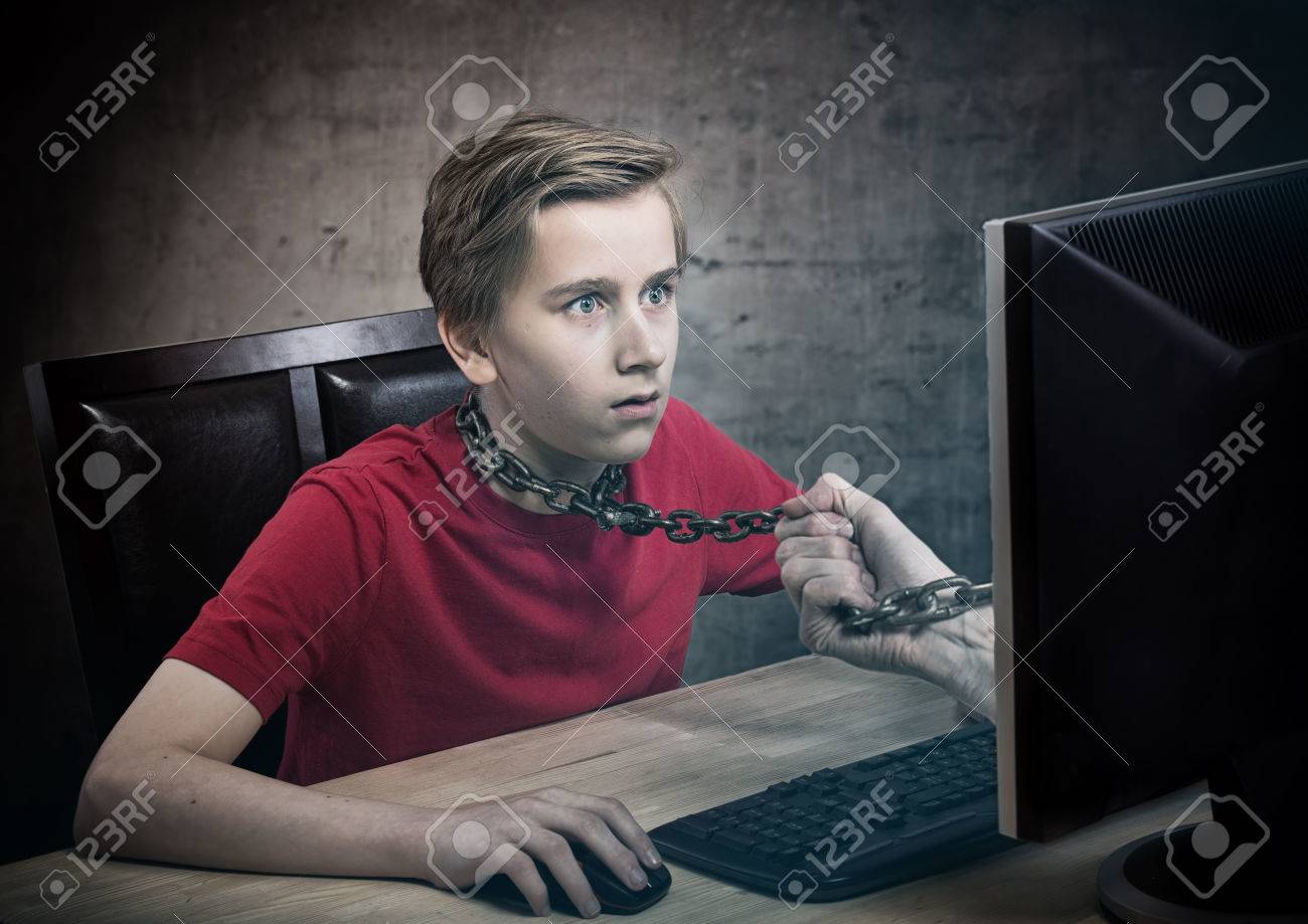 teenager chained to his computer addiction concept computer addiction