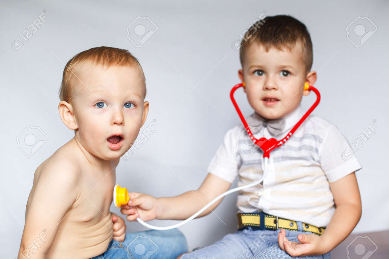 children playing doctor and patient two little boys using stethoscope children play doctor